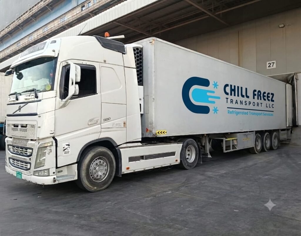 Refrigerated transport truck with Chill Freez Transport LLC branding at a loading facility